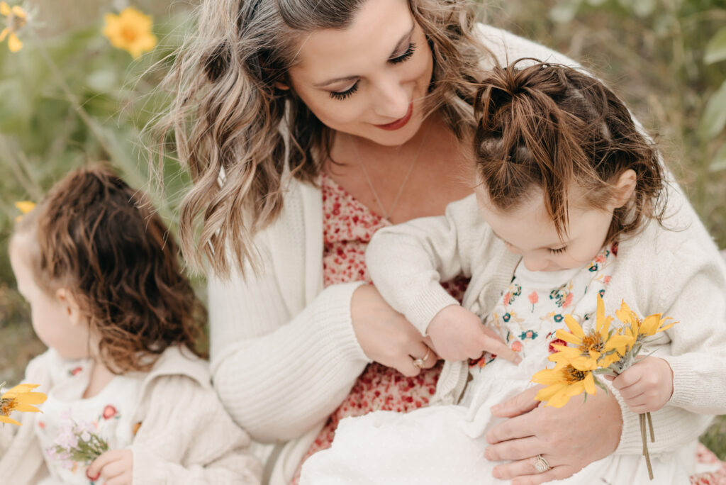 Mom with twin girls cuddle in Penticton