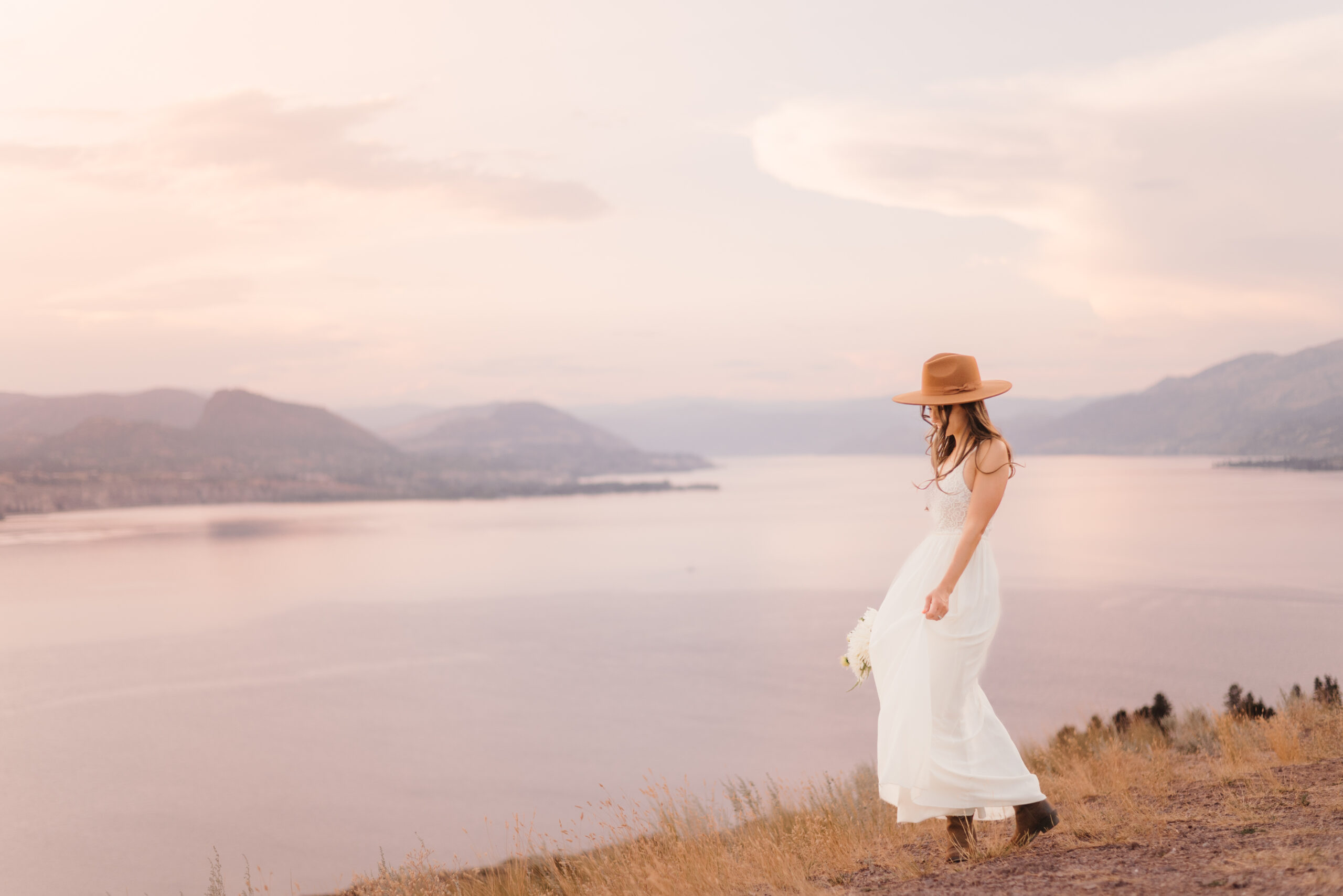 bride at sunset with Kelowna wedding hair and makeup