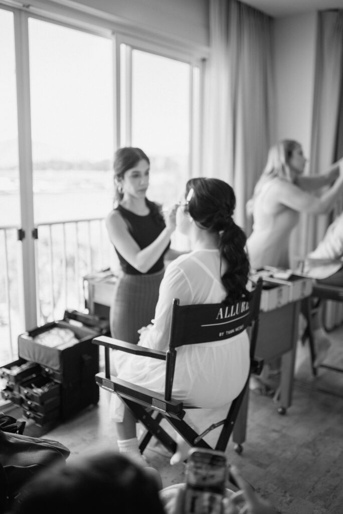 bride gets her makeup done by a kelowna makeup and hair artist