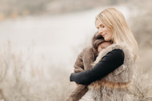 mom holding baby considering which kelowna daycare to choose