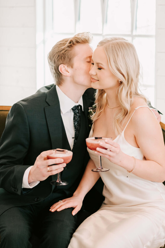 couple enjoying their drinks on their wedding day in Kelowna