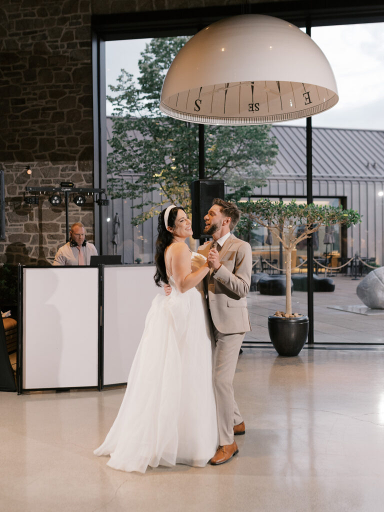bride and groom enjoy a joyful first dance put on by a kelowna wedding dj