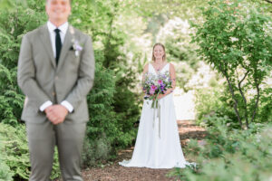 photography of bride and groom getting ready for their first look in the Okanagan
