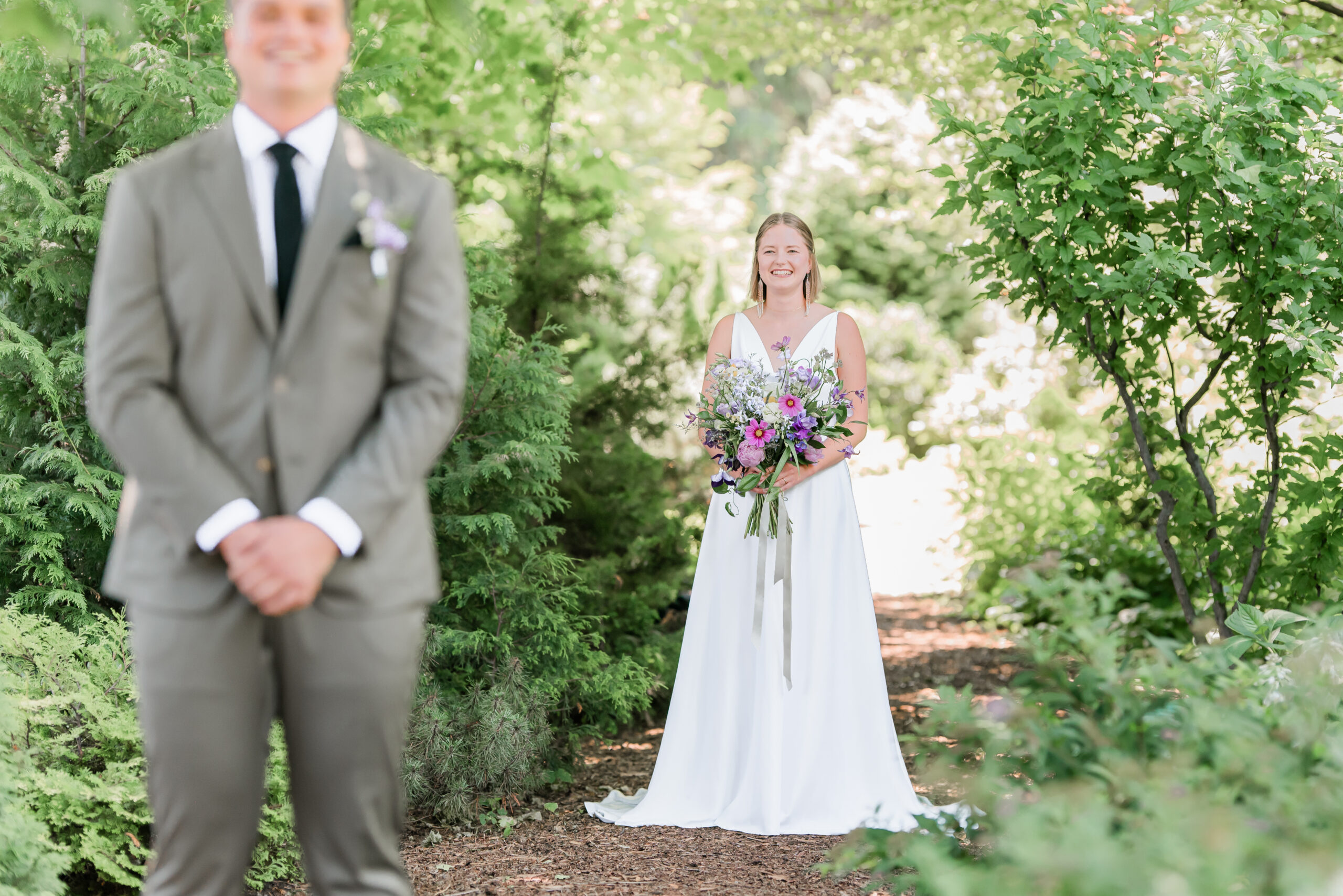 photography of bride and groom getting ready for their first look in the Okanagan