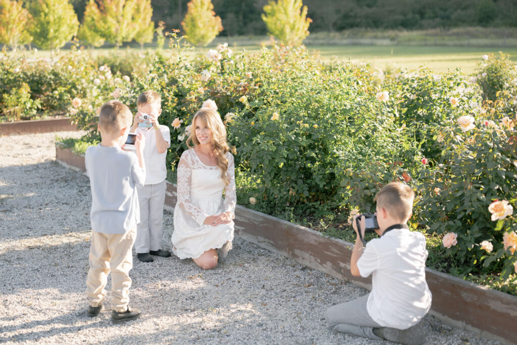 3 little boys take photos of their mom