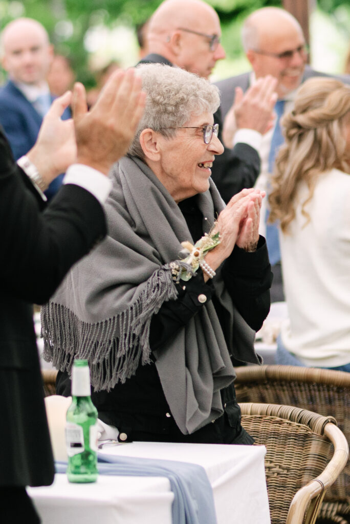 Grandma enjoys her time at a linden gardens wedding
