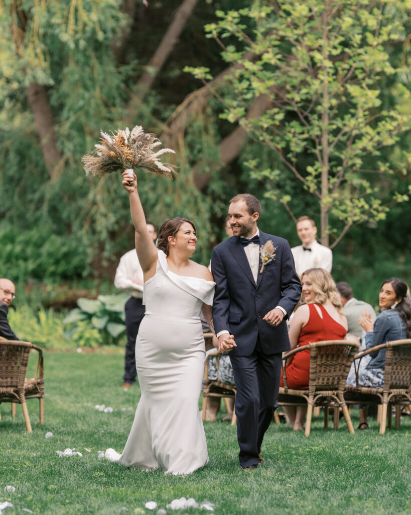 couple walk down the aisle at a linden gardens wedding