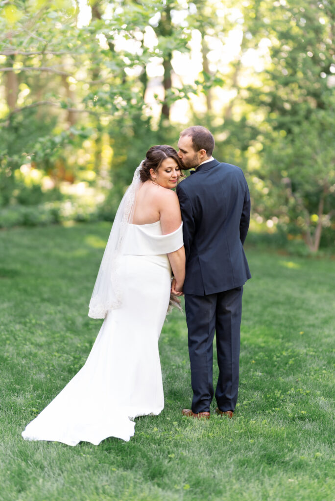 groom kisses bride's temple at a linden gardens wedding